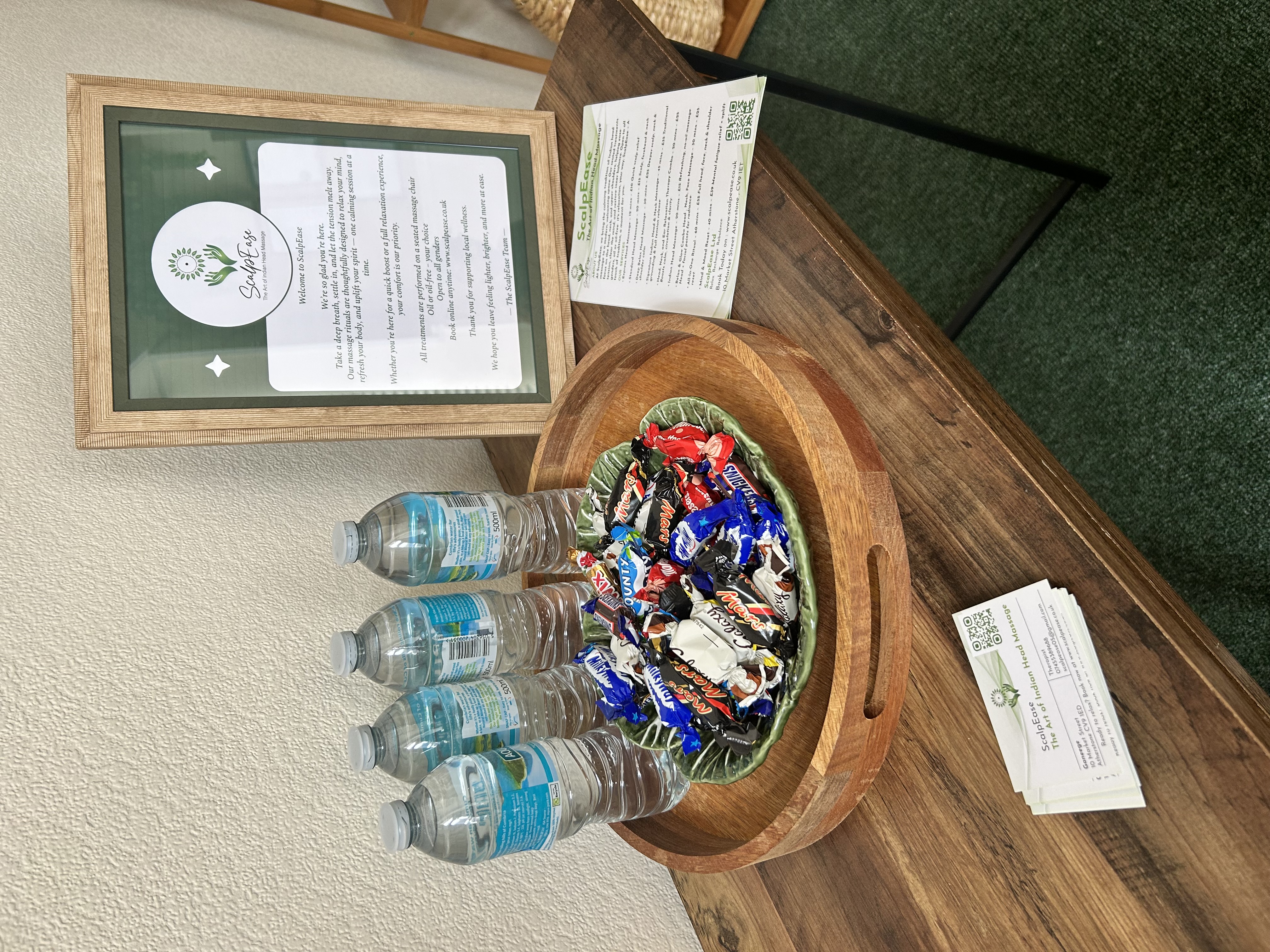 Welcome table with water and sweets